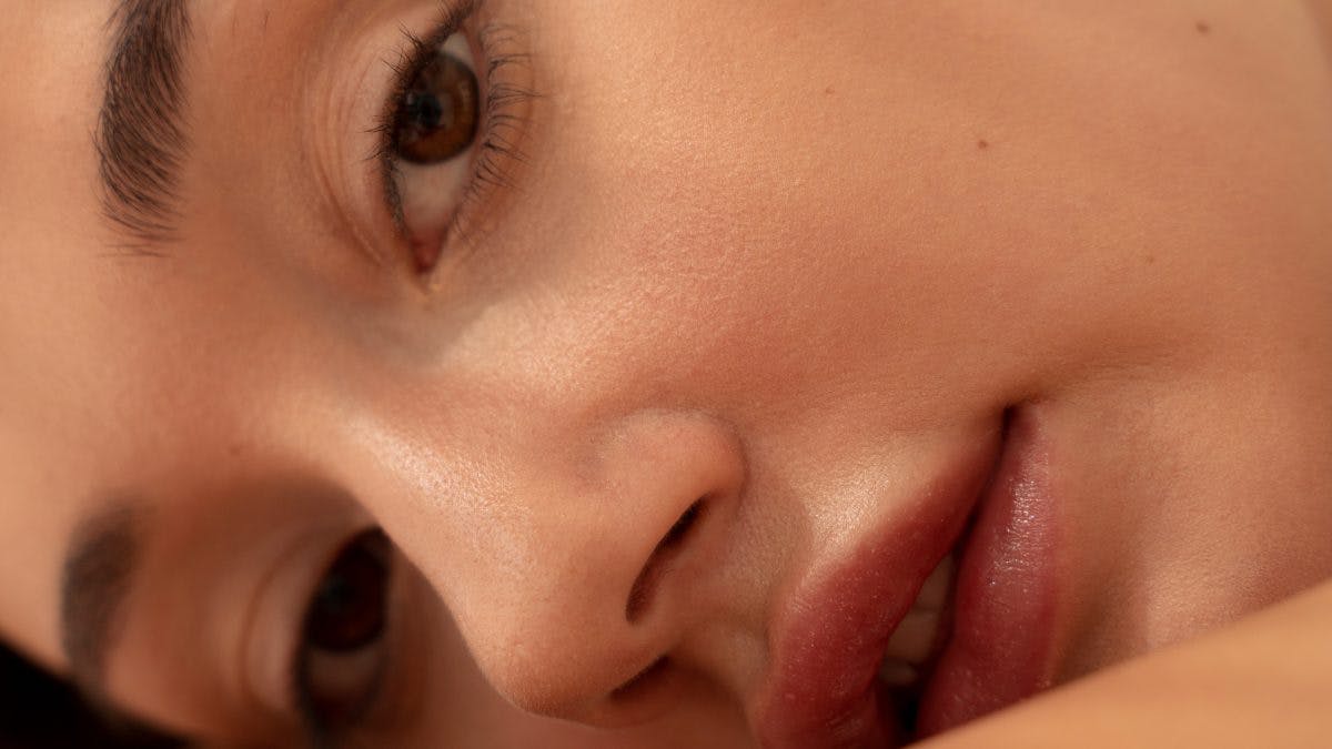 Image of a woman lying down, close up