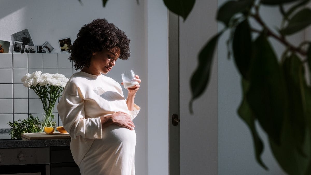 Pregnant Woman drinking milk