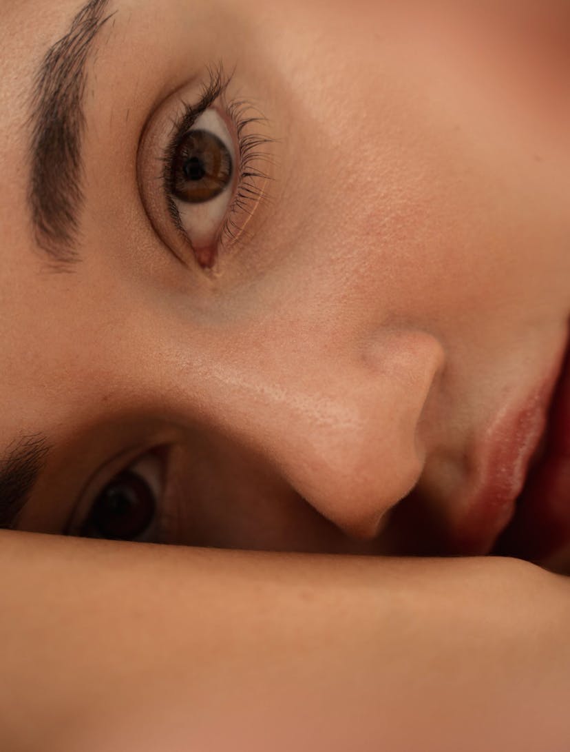 Close-up image of a woman with long lashes after using lash growth serum.