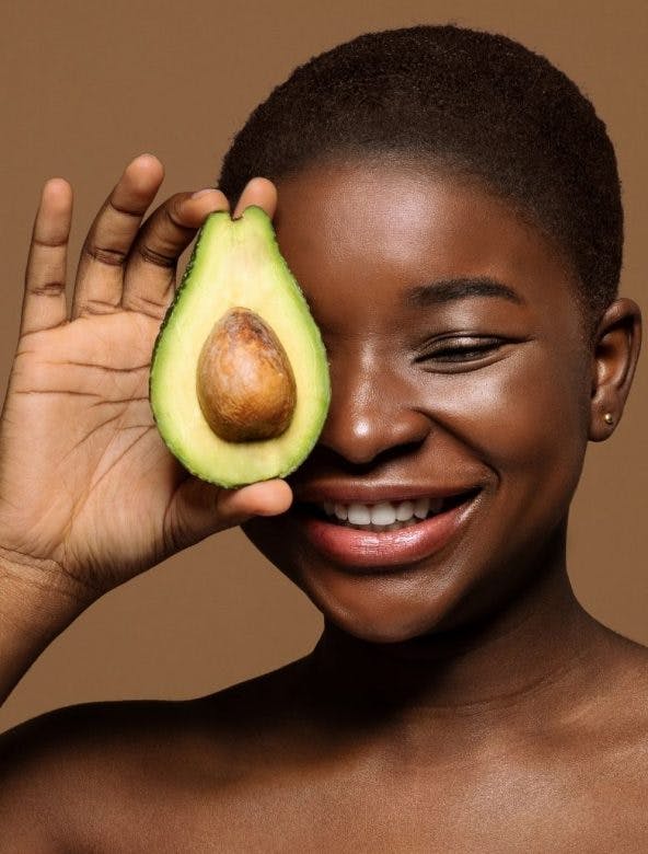 Model holding avocado