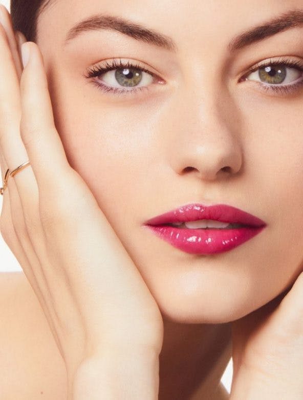 Woman wearing pink lip gloss