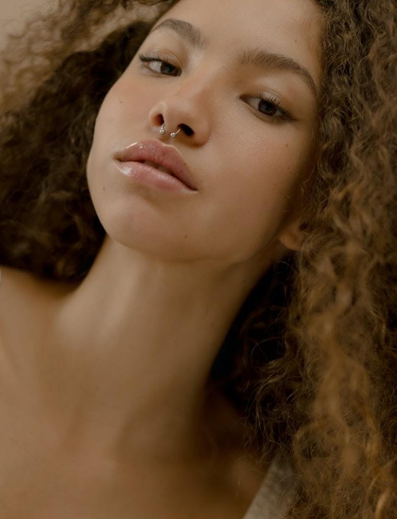 model wearing lip oil
