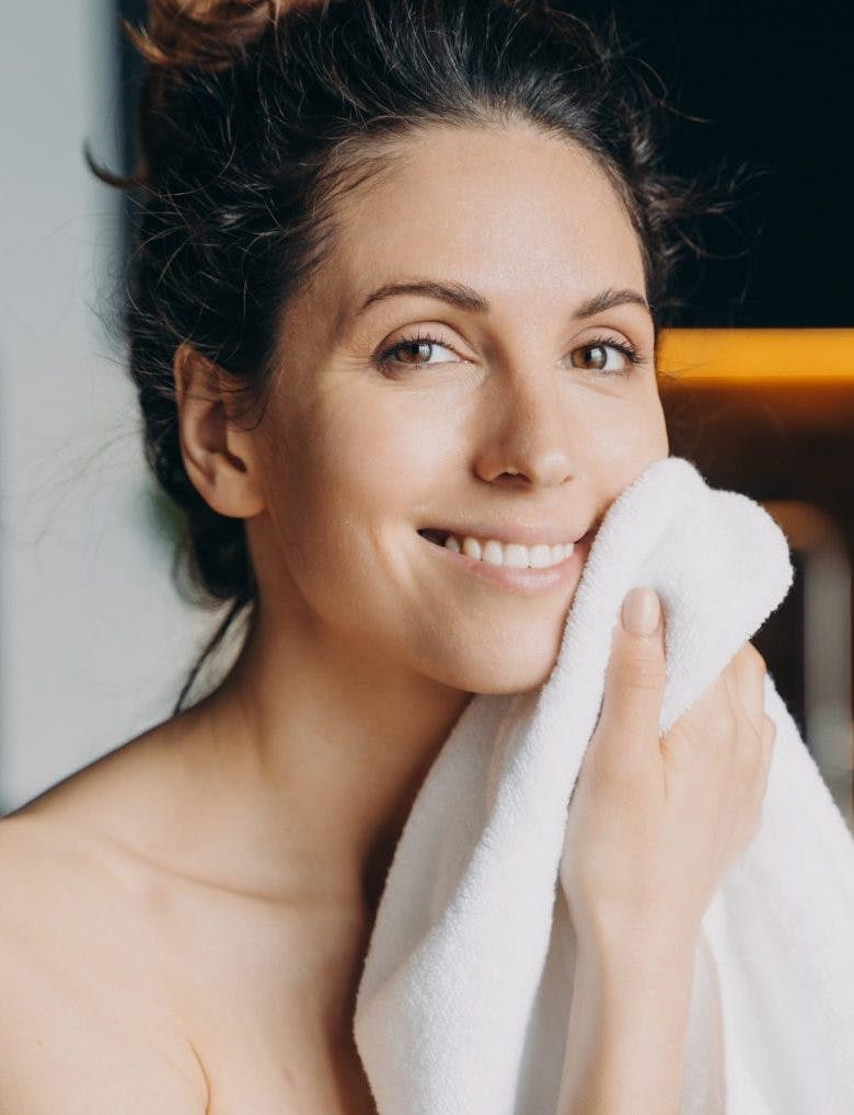 Face wash for sensitive skin brunette woman towel