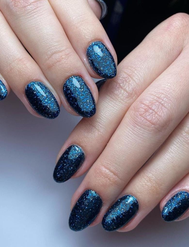 dark blue starry manicure