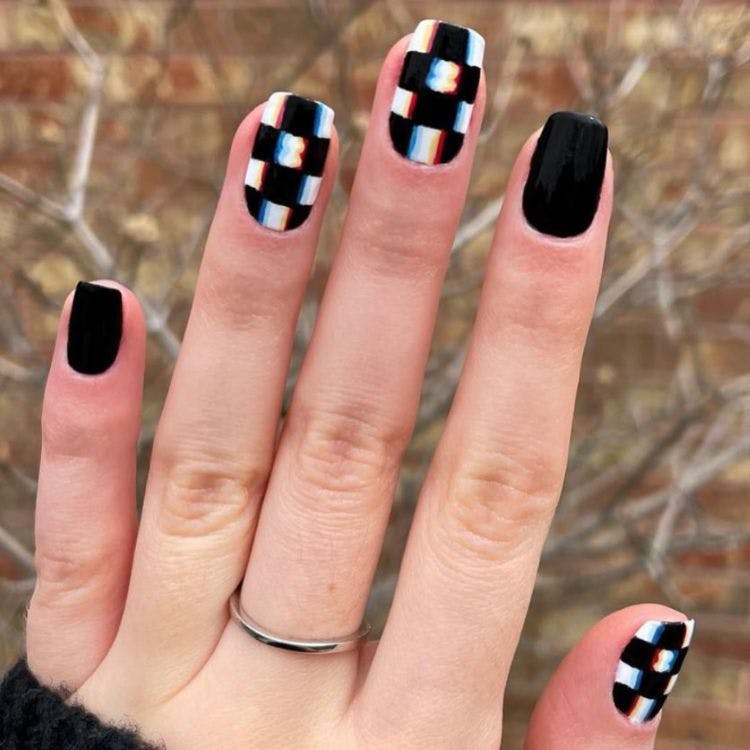 RGB effect checkered black and white nail design