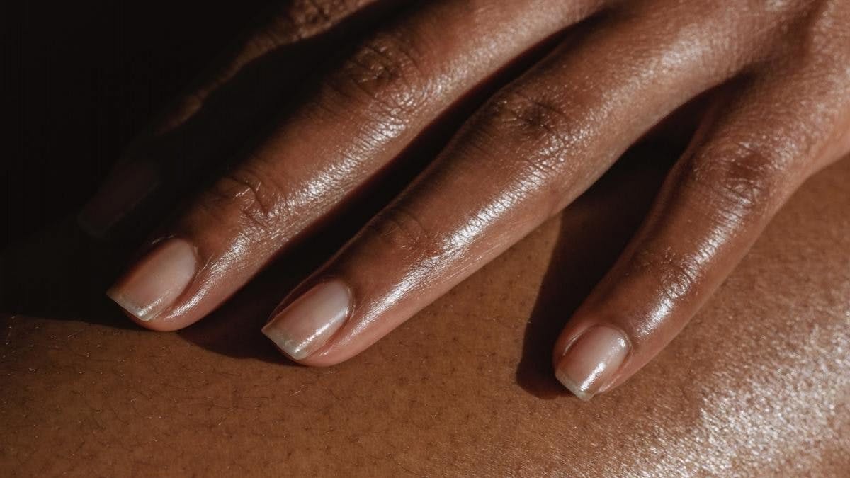 hands with ridges on the nails